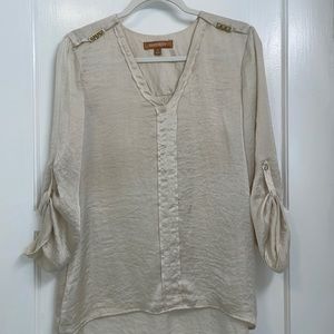 Beautiful cream silk top. Gold grommet details on color bone. Super chic.